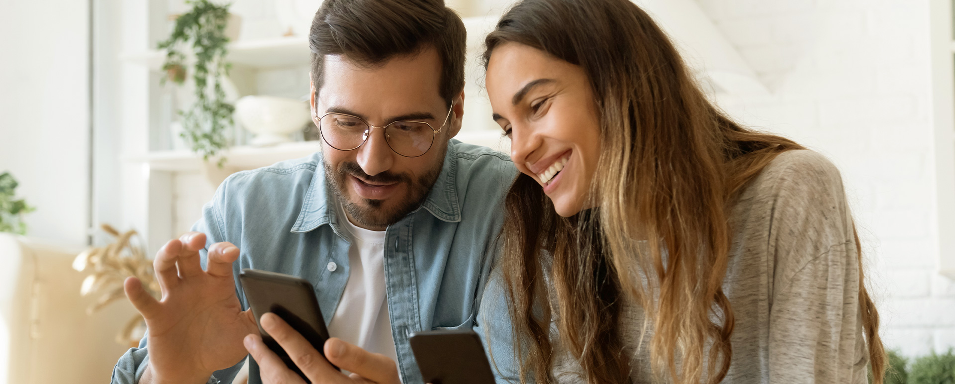 Man and woman interacting with a mobile app